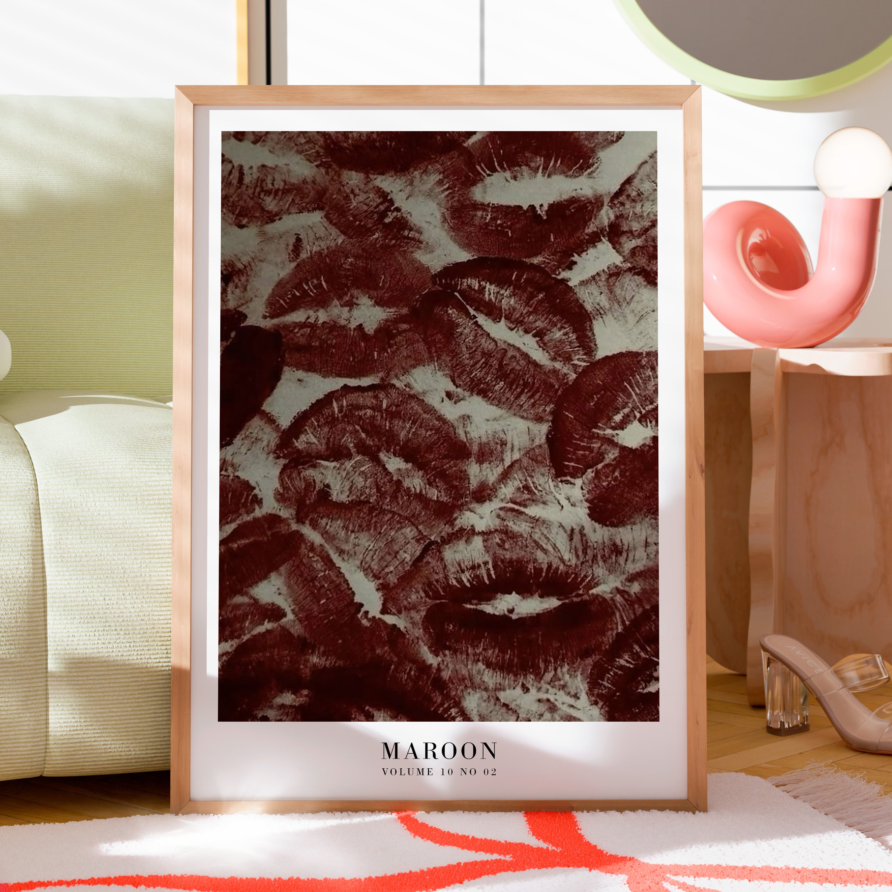 Maroon lipstick kiss print displayed in moody red aesthetic apartment