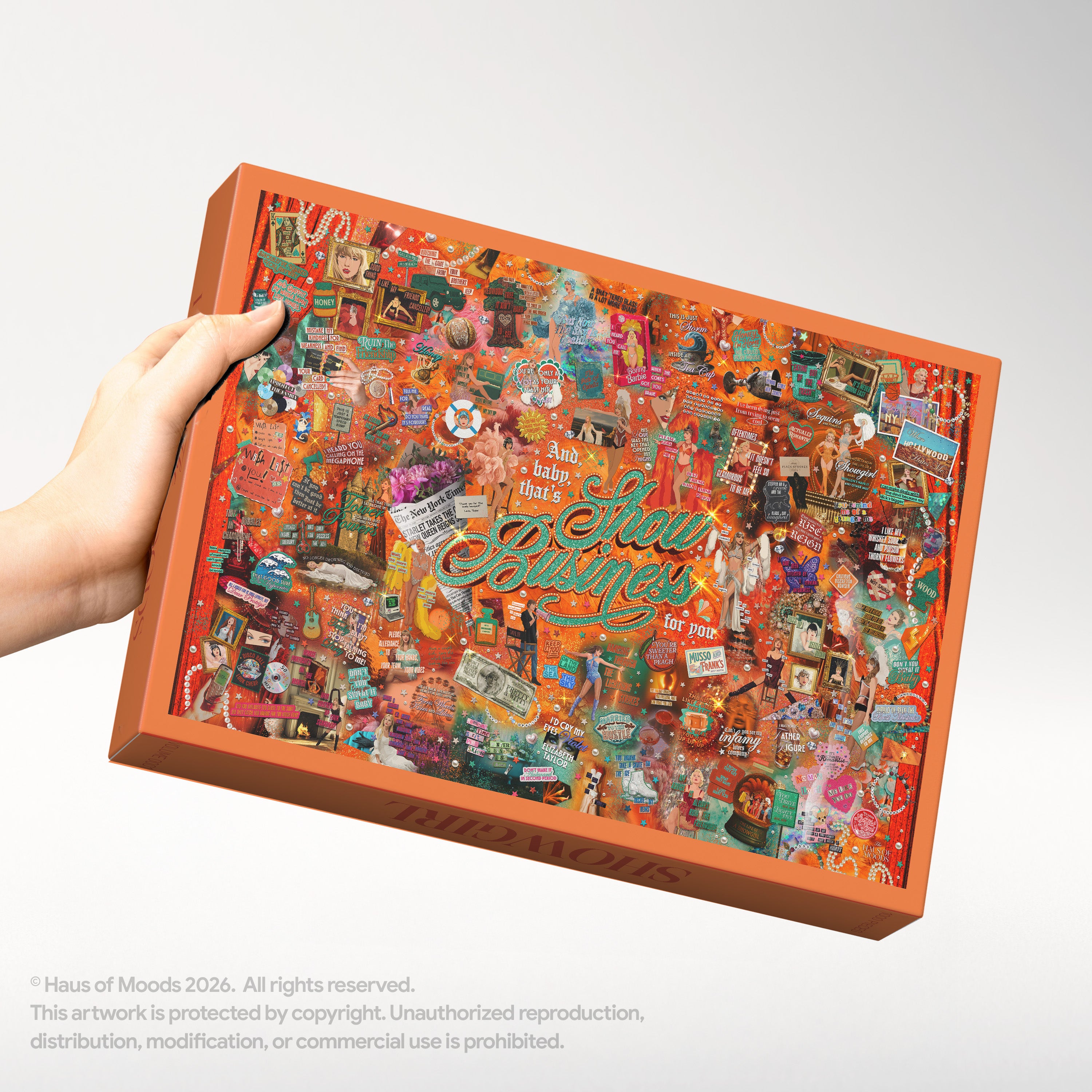 Haus Of Moods Showgirl Lyrics & Easter Eggs puzzle box with colorful artwork and branding, featuring a vibrant showgirl design.
