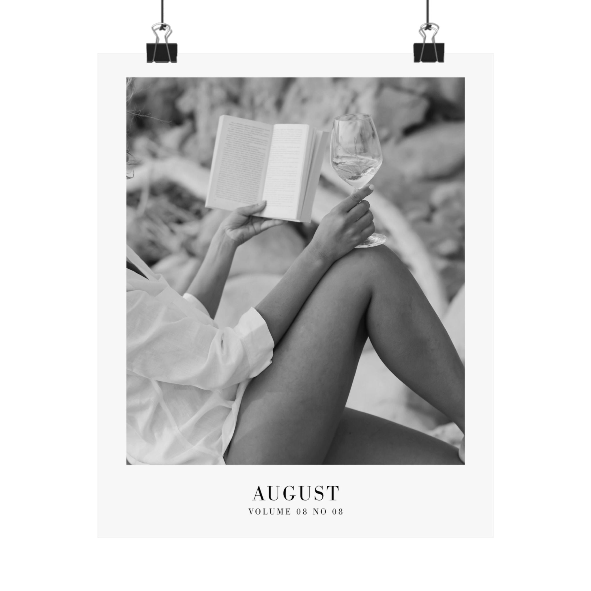 August Folklore poster styled above a reading chair in a cozy literary bedroom