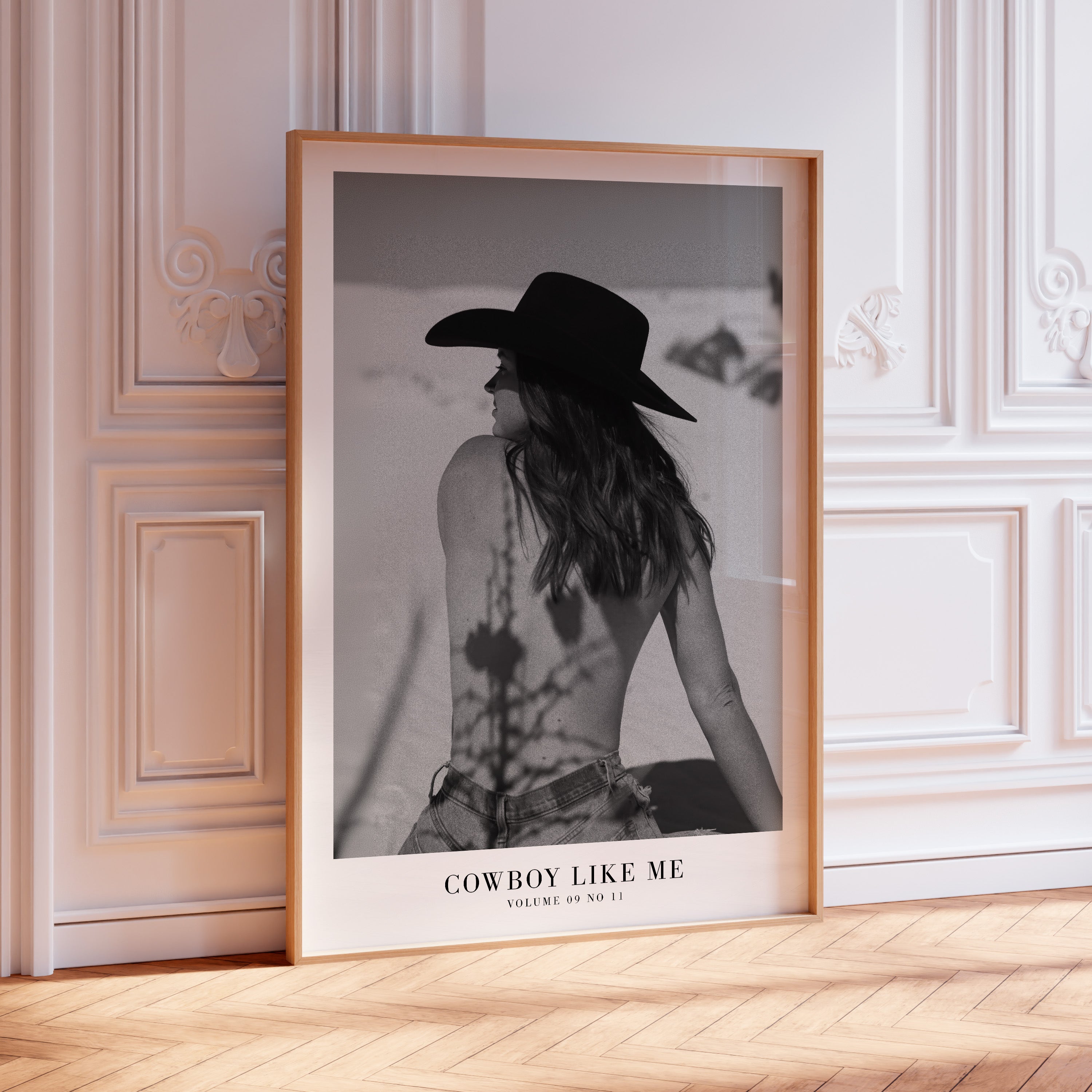 Cowboy Like Me Evermore Song wall art in black-and-white apartment
