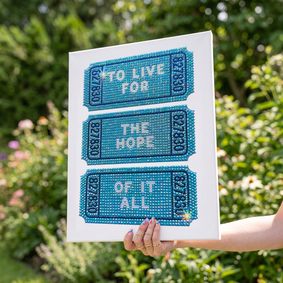 DIY craft kit by Haus of Moods featuring a rhinestone canvas artboard for creating a "To Live For The Hope of It All" design.