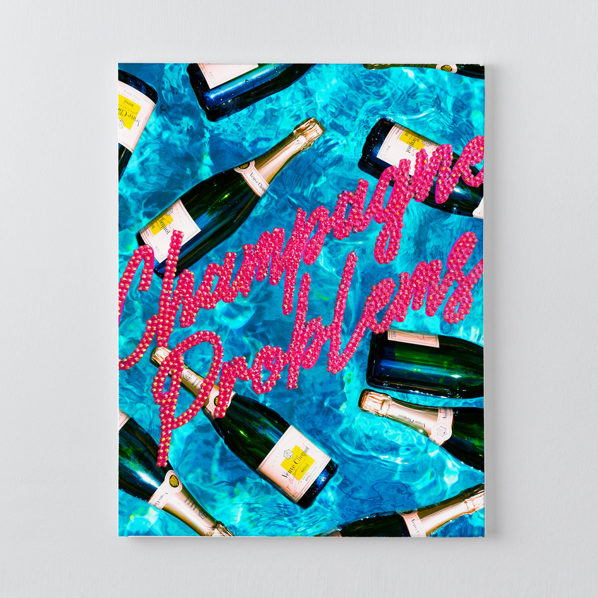 Champagne Problems DIY rhinestone canvas kit, pink script over a printed pool scene