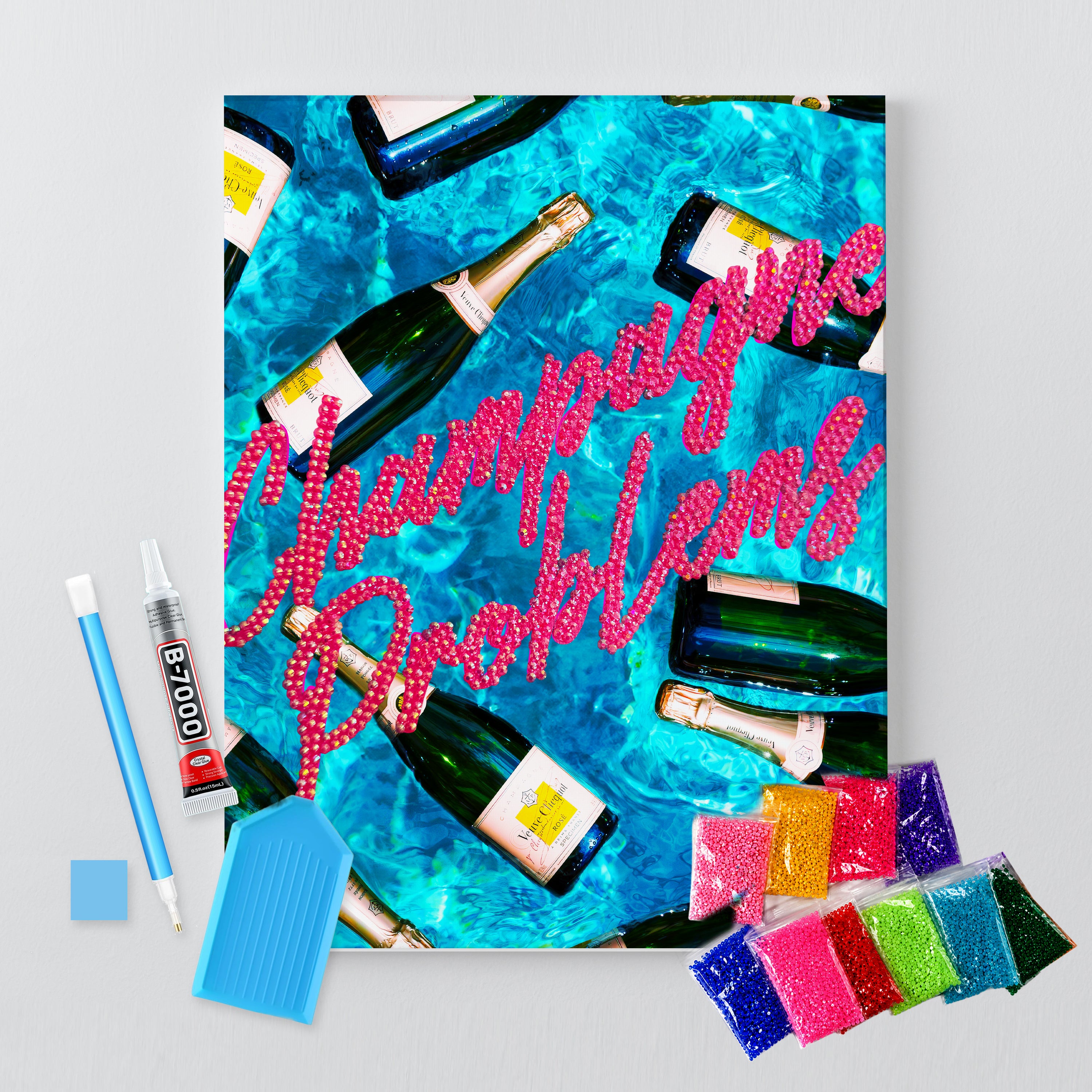 Champagne Problems rhinestone canvas kit shown in a styled room