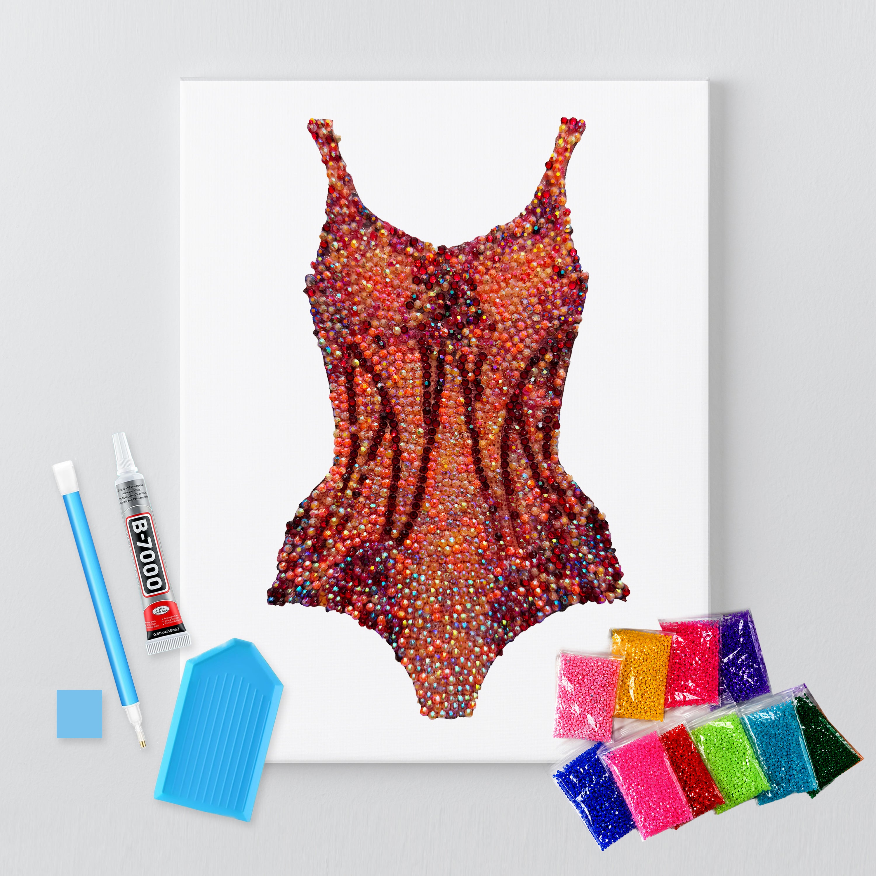 Lover orange bodysuit bedazzle canvas kit shown in a styled room