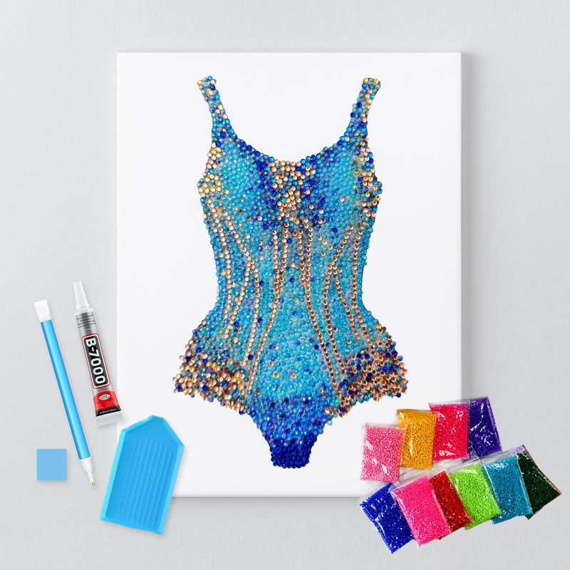 Lover blue and gold bodysuit rhinestone canvas kit shown in a styled room