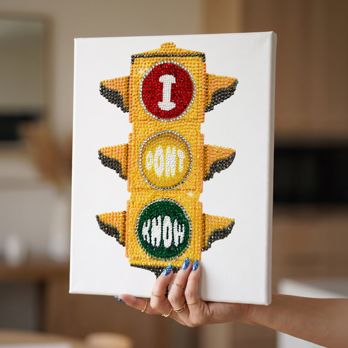 DIY craft kit by Haus of Moods featuring a canvas with a traffic light design and rhinestone embellishments for bedazzling.