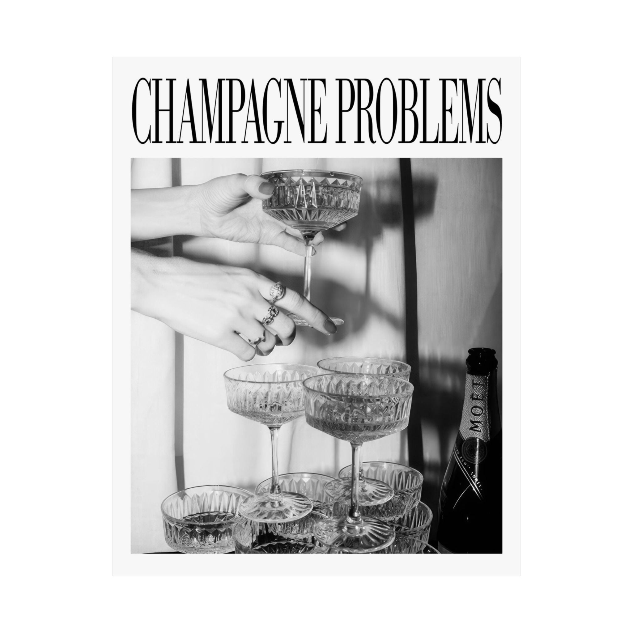 Black and white image of hands pouring champagne into glasses with Moët & Chandon branding.