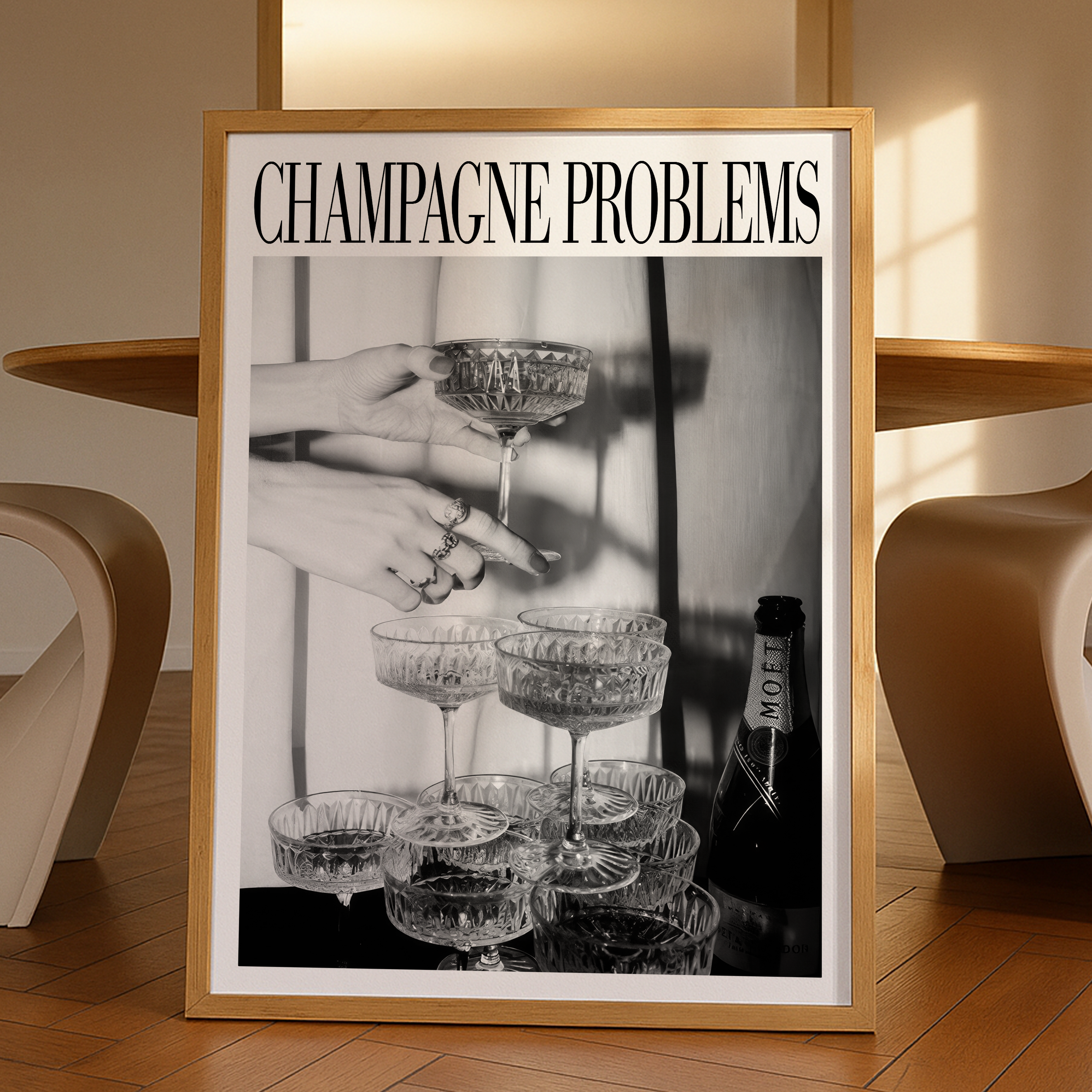 Taylor Swift poster print unrolled on table for framing Framed artwork titled 'Champagne Problems' with a black and white photo of hands and glasses.